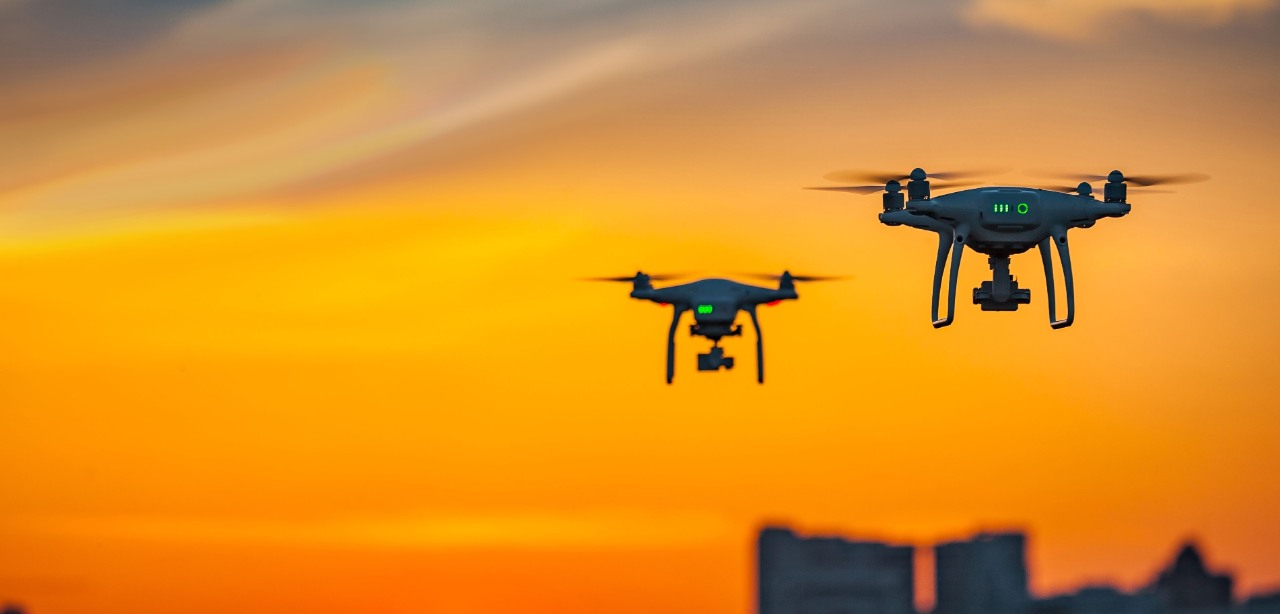 Two drone quad copters with high resolution digital camera flying, Two drone quad copters with high resolution digital camera flying